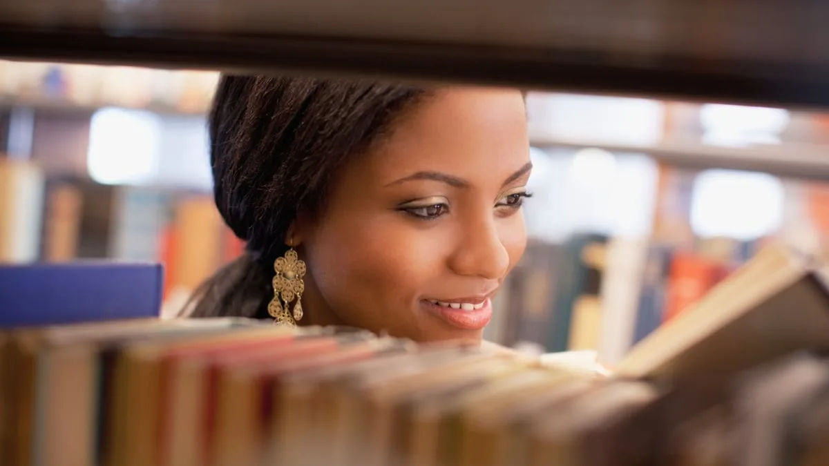 student in library