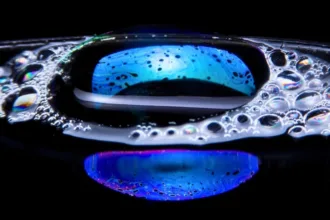 two blue colorful bubbles on a black background