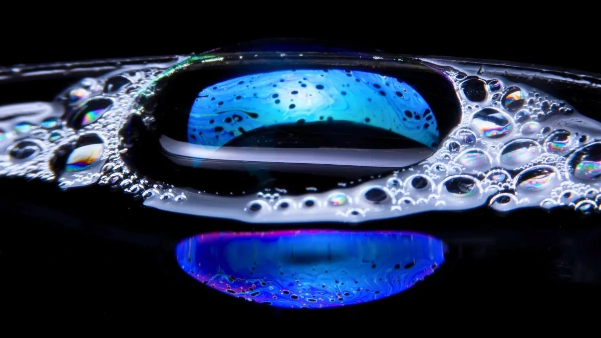 two blue colorful bubbles on a black background